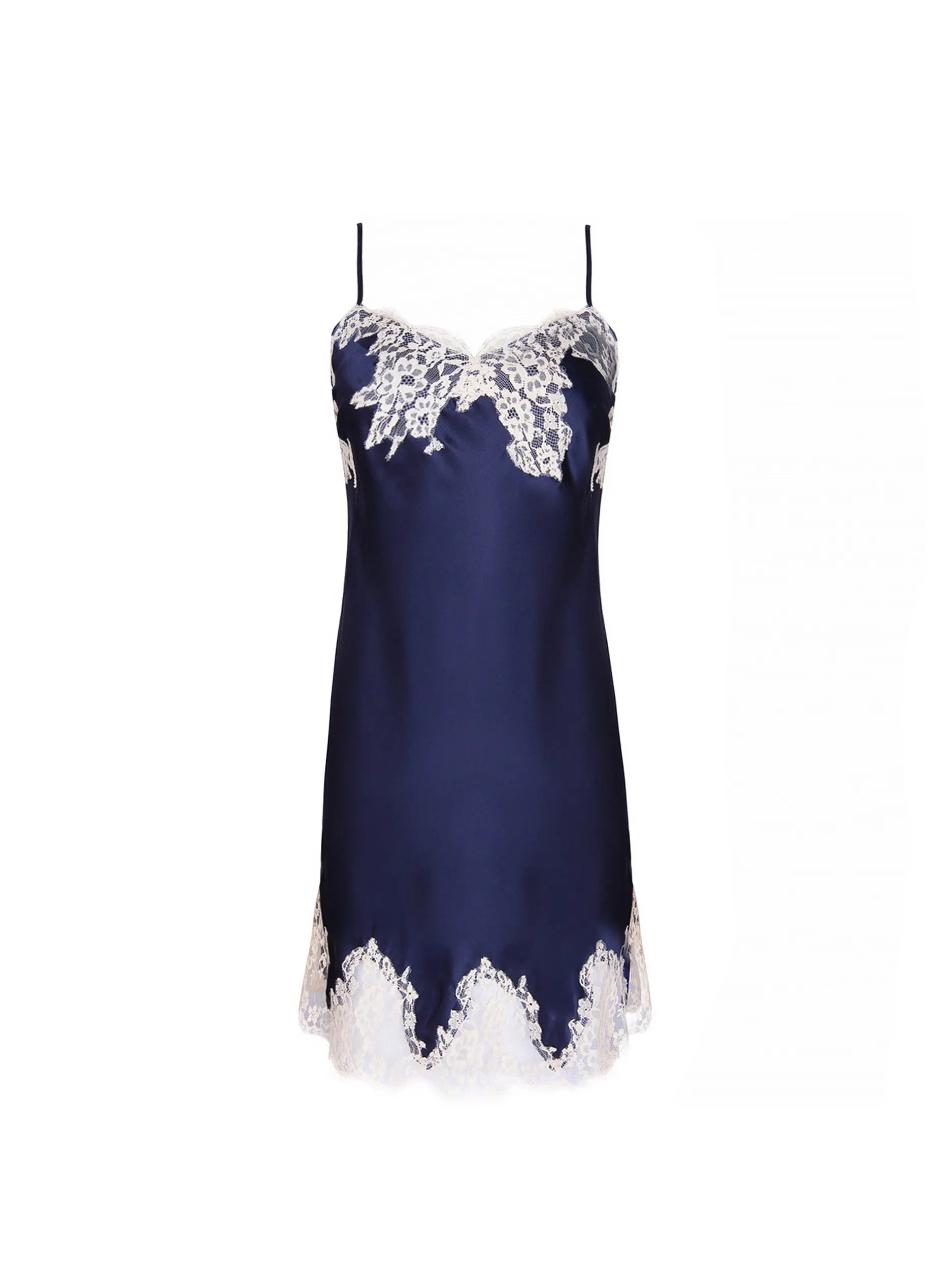 A navy satin slip dress with light lace trim is displayed against a white background.