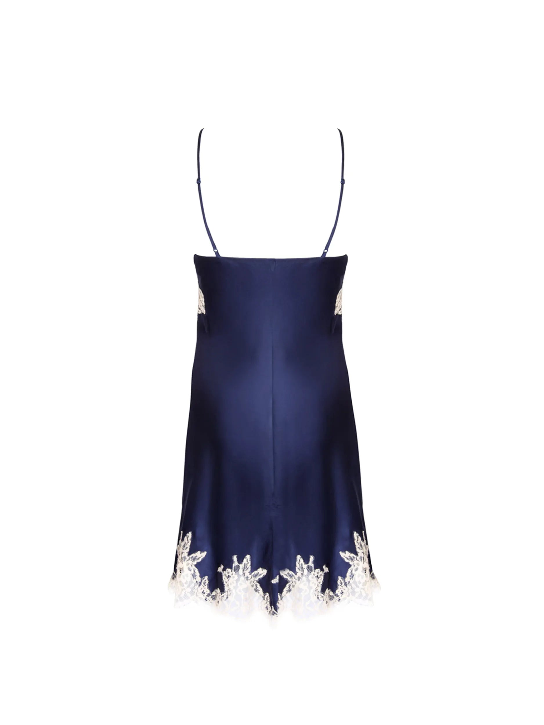 A navy satin slip dress with light lace trim is displayed from the back against a white background.