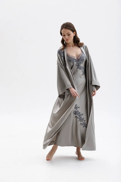 Woman wearing a long classy silk kimono stile dressing gown with matching elegant silk nightdress with floral embroidery (sold separately). Full front picture.