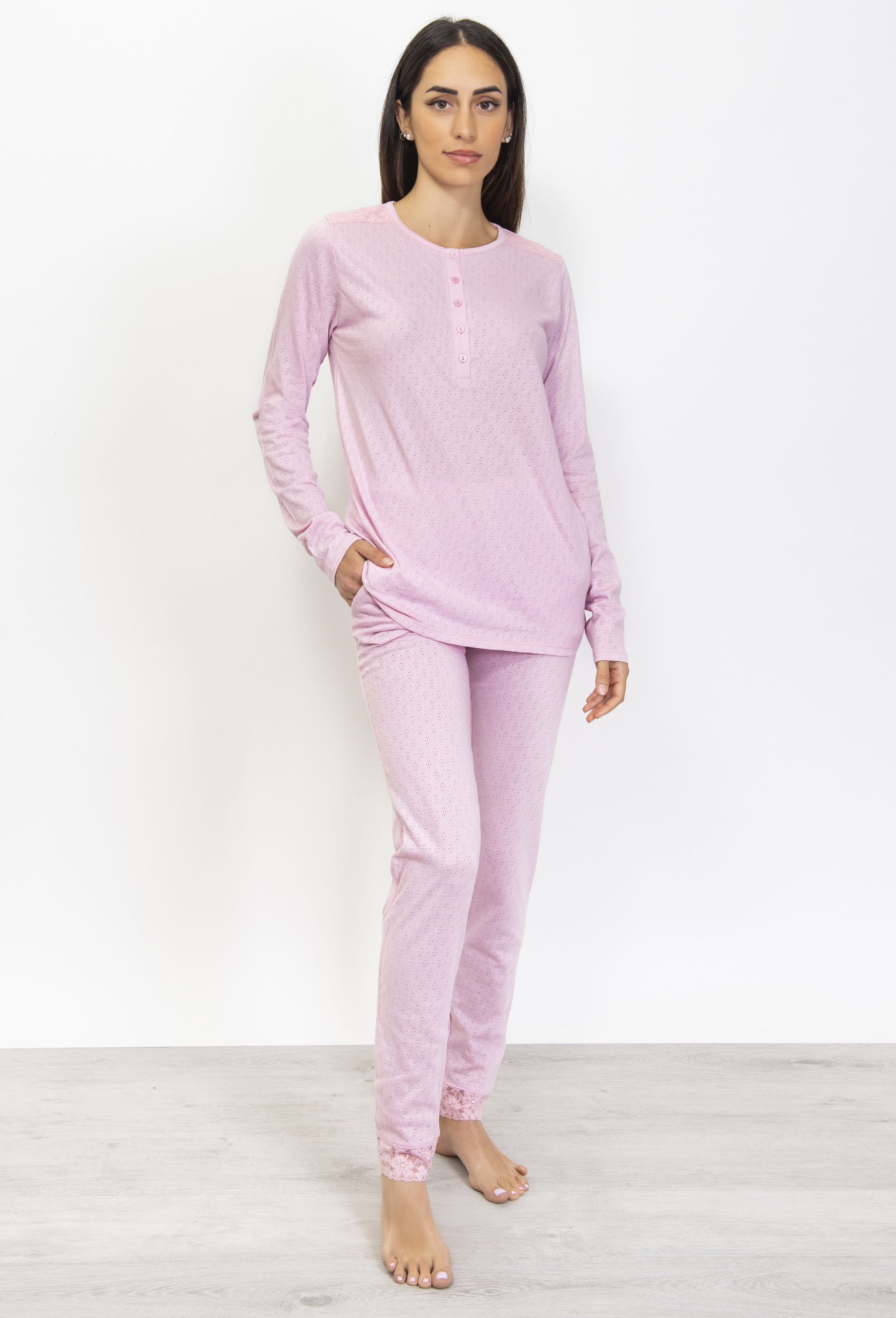 This premium pointelle cotton pajama set is crafted with a soft, subtly-textured fabric. Its long-sleeved top and trousers feature an elegant color palette that strikes a balance between comfort and style. 
