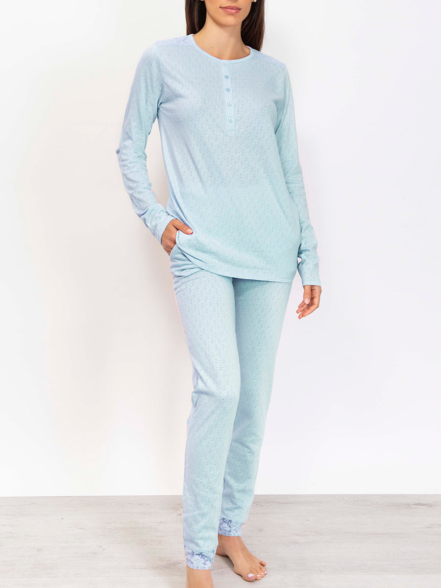 This premium pointelle cotton pajama set is crafted with a soft, subtly-textured fabric. Its long-sleeved top and trousers feature an elegant color palette that strikes a balance between comfort and style. 