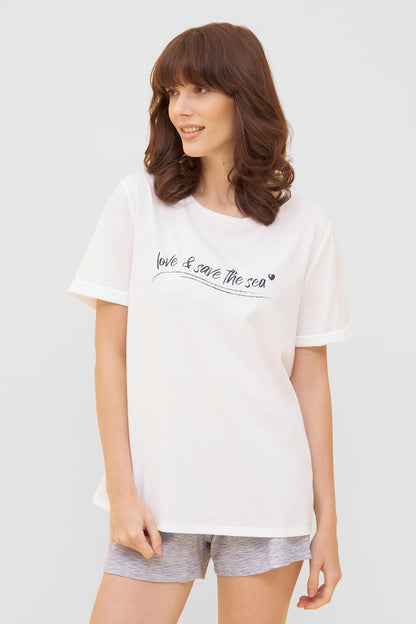 Women is wearing Be Happy Jersey Cotton Loose T-Shirt front picture with matching shorts (sold separately)