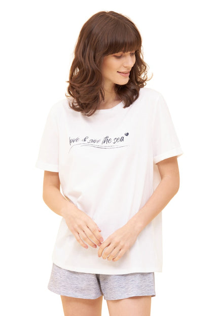 Women is wearing Be Happy Jersey Cotton Loose T-Shirt front picture with matching shorts (sold separately)