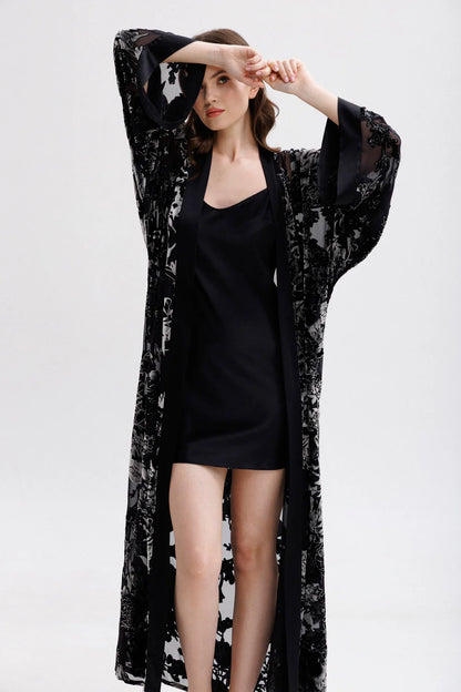 Woman wearing a black silk short slip dress with spaghetti straps showing the full figure with matching silk-velvet kimono(sold separately)
