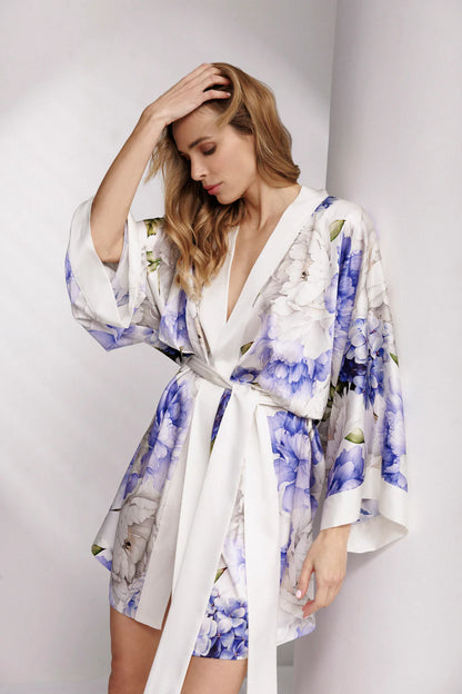 Woman wearing a silk floral short robe.